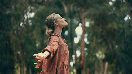 Woman breathing fresh air outdoors	