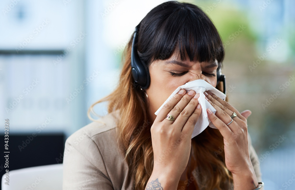 Sick, woman and blowing nose with headset in office for virus, illness and allergy symptoms. Sneezing, disease and tissue with customer support suffering with infection for flu, fever and cold Sick, woman and blowing nose with headset in office for virus, illness and allergy symptoms. Sneezing, disease and tissue with customer support suffering with infection for flu, fever and cold