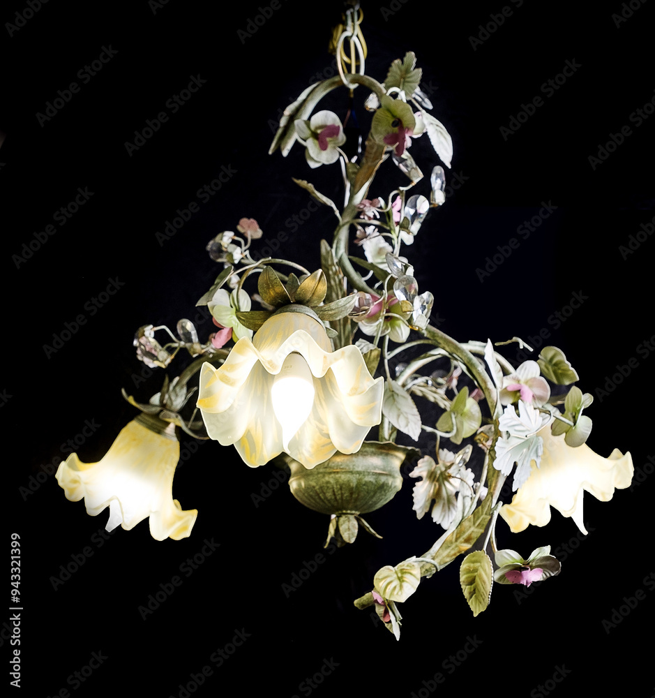 Chandelier lamp with flowers and metal, Bohemian glass Beautiful exquisite natural motifs with crystals on a black background isolate