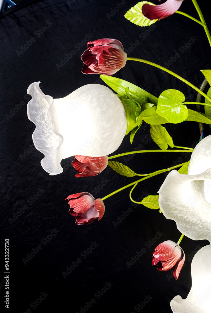 Chandelier lamp with flowers and metal, Bohemian glass Beautiful exquisite natural motifs with crystals on a black background isolate