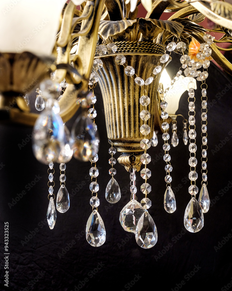 Chandelier lamp with flowers and metal, Bohemian glass Beautiful exquisite natural motifs with crystals on a black background isolate
