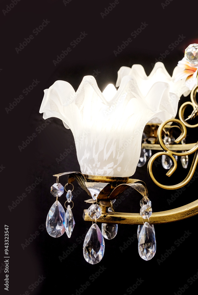 Chandelier lamp with flowers and metal, Bohemian glass Beautiful exquisite natural motifs with crystals on a black background isolate