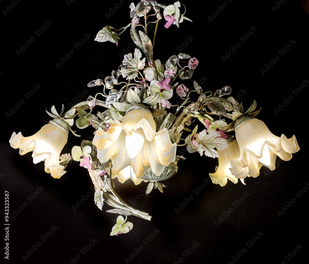Chandelier lamp with flowers and metal, Bohemian glass Beautiful exquisite natural motifs with crystals on a black background isolate