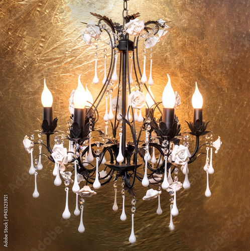 Chandelier lamp with flowers and metal, Bohemian glass Beautiful exquisite natural motifs with crystals on a black background isolate