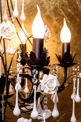 Chandelier lamp with flowers and metal, Bohemian glass Beautiful exquisite natural motifs with crystals on a black background isolate