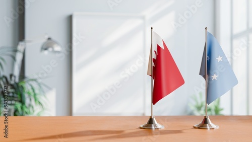 FLAGS OF BAHRAIN AND MICRONESIA ON TABLE