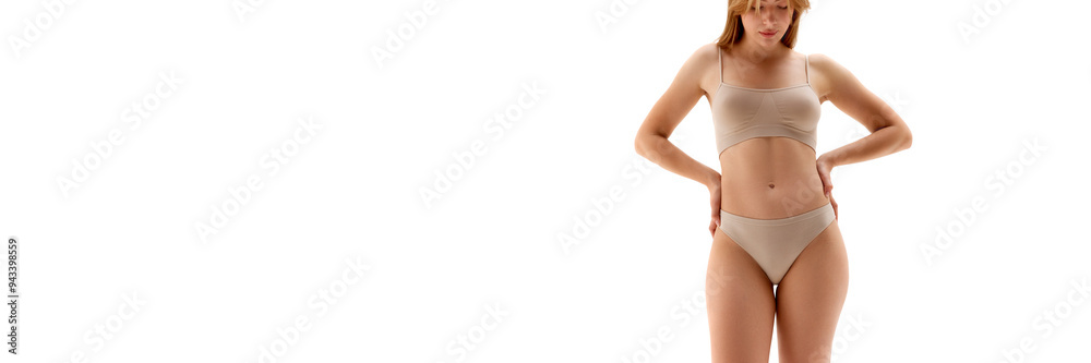 Cropped image of young woman posing in underwear isolated on white background. Fit sportive body shape. Concept of female beauty, body and skin care, cosmetology, health. Banner. Copy space for ad Cropped image of young woman posing in underwear isolated on white background. Fit sportive body shape. Concept of female beauty, body and skin care, cosmetology, health. Banner. Copy space for ad