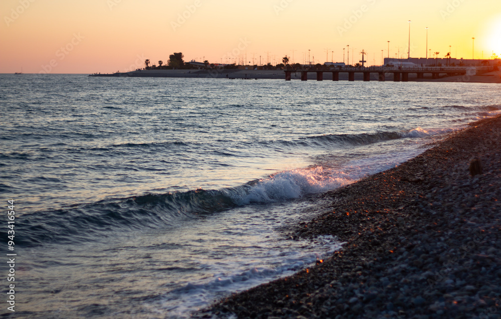 Sea wave crashing on the shore. Sunset at sea in Sochi (Adler).