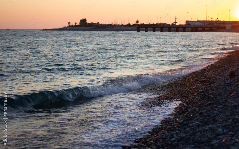 Sea wave crashing on the shore. Sunset at sea in Sochi (Adler).