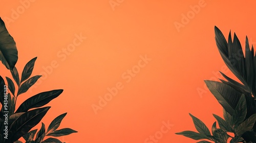 Vibrant orange backdrop framed by lush green tropical leaves.