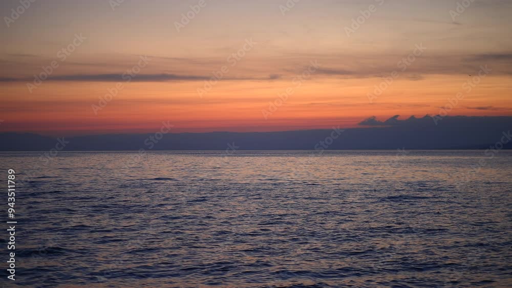 A stunning ocean sunset paired with a vibrant sky, bringing serenity and calmness A stunning ocean sunset paired with a vibrant sky, bringing serenity and calmness