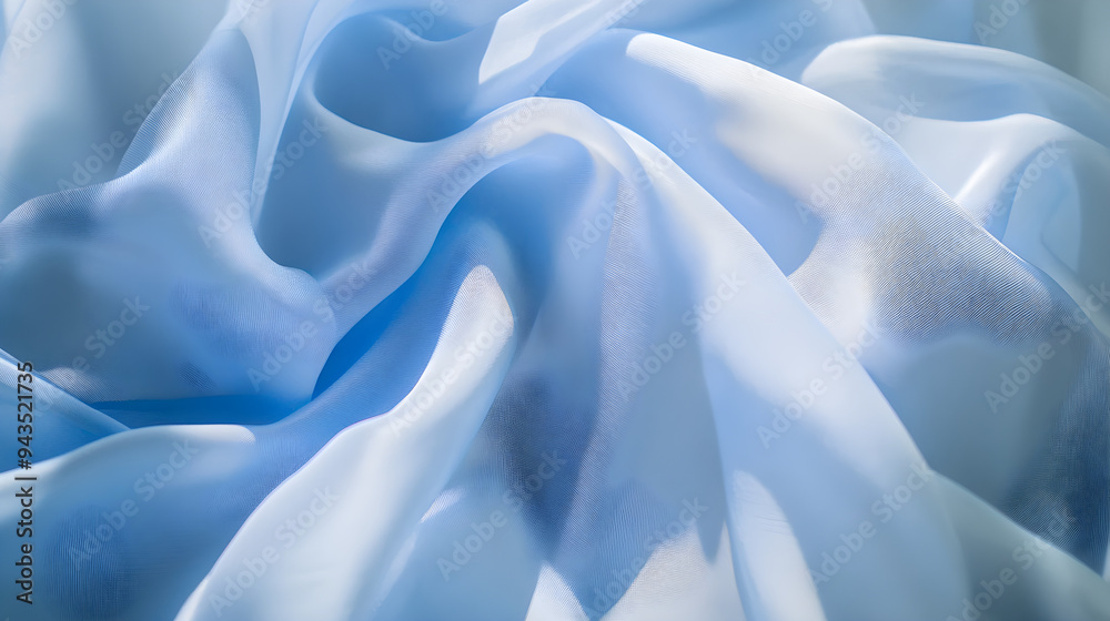 Obraz premium Soft sky blue fabric with gentle folds and shadows creating a serene and tranquil atmosphere perfect for backgrounds or textile designs