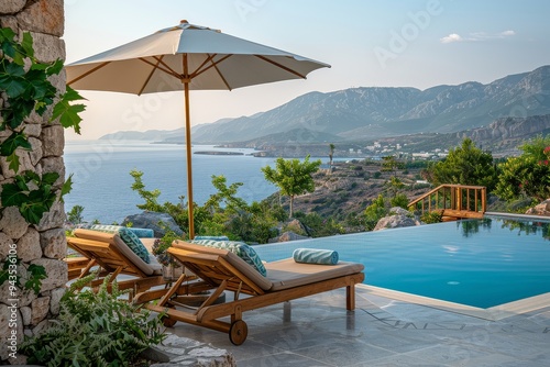 Beige and Blue Sunbeds with Umbrella by Pool Overlooking Cretan Sea at Chillyfiro Resort, Evening Light photo