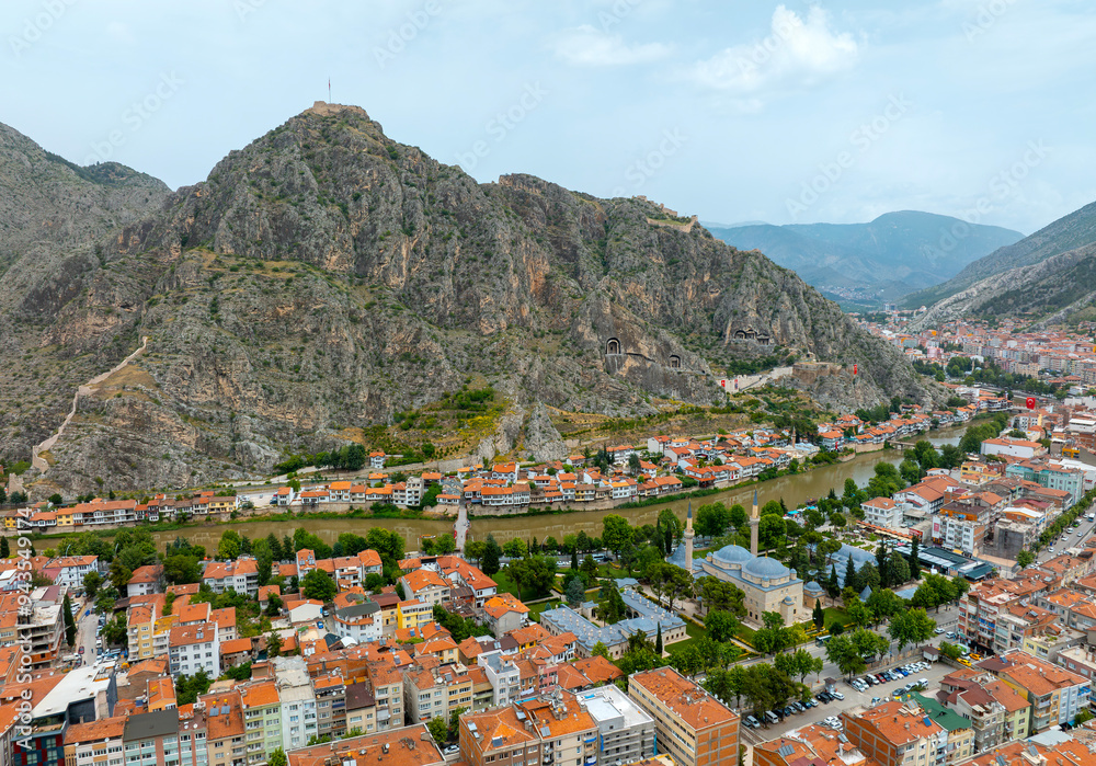 Fascinating view of the city of Amasya, also known as the city of princes. wonderful clouds coming out of the mountains. YESILIRMAK river.