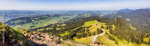 Panoramablick vom Grünten im Allgäu Richtung Norden auf eine Berghütte im Hintergund links der Rottachspeicher und rechts der Grüntensee photo