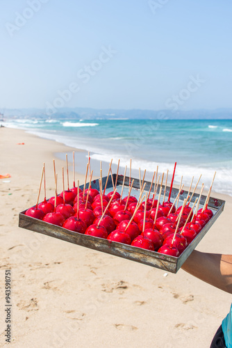 Vendor of Candy Apples at the beach in Skikda, Algeria. photo