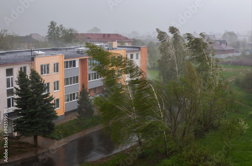 hurricane with rain in the city in spring