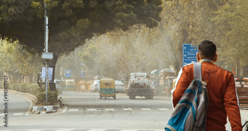 Obraz na płótnie New Delhi, Delhi, India. Fire truck spraying water over Delhi streets amid pollution emergency. The government plans to spray the city with water in an attempt to clear the toxic smog cloud w salonie
