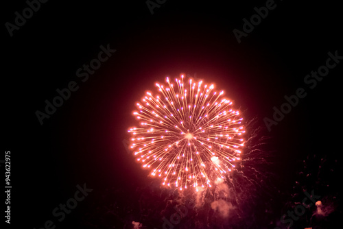 Fireworks on the dark sky background. Colorful fireworks from Loto Quebec in Quebec city, Canada. Abstract colored firework background with free space for text. fireworks light up the night sky
