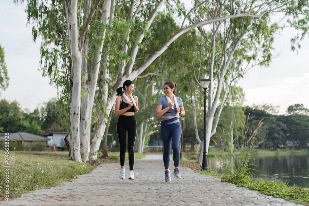 Young Female Friends Exercising Together in a Park, Enjoying Outdoor Fitness and Healthy Lifestyle Young Female Friends Exercising Together in a Park, Enjoying Outdoor Fitness and Healthy Lifestyle