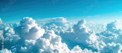 White cumulus clouds in a blue sky Background Copy space photo