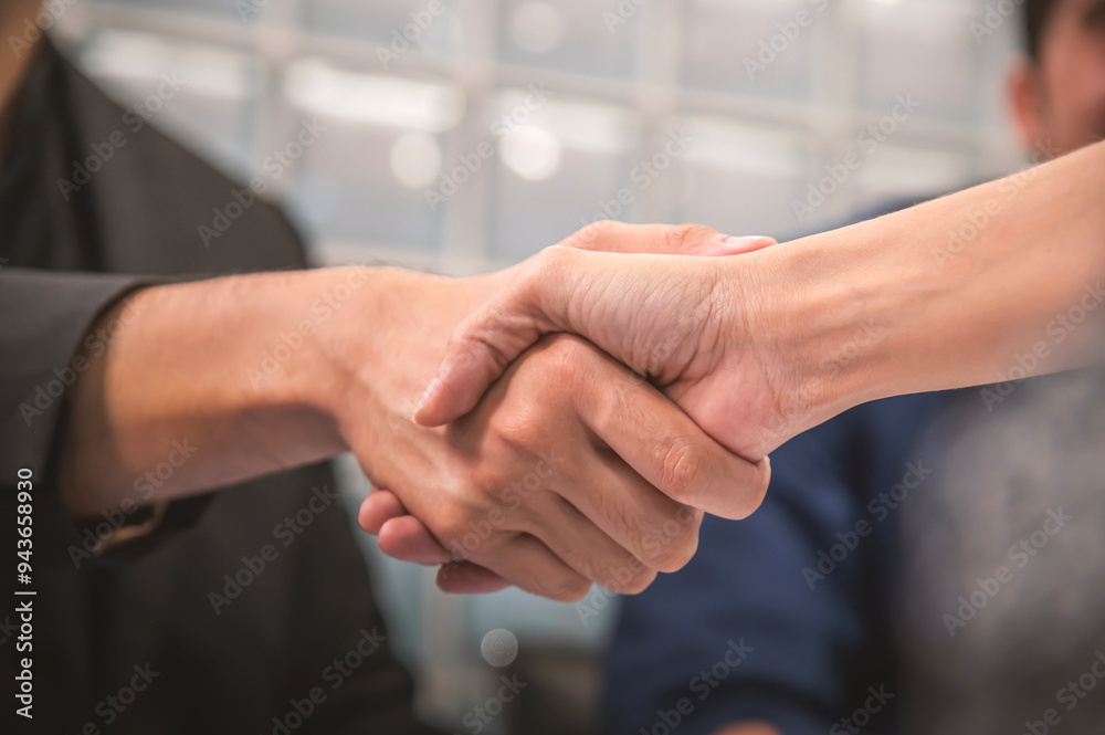 Close up of a successful business people shaking hands.
Close up of a successful business people shaking hands.