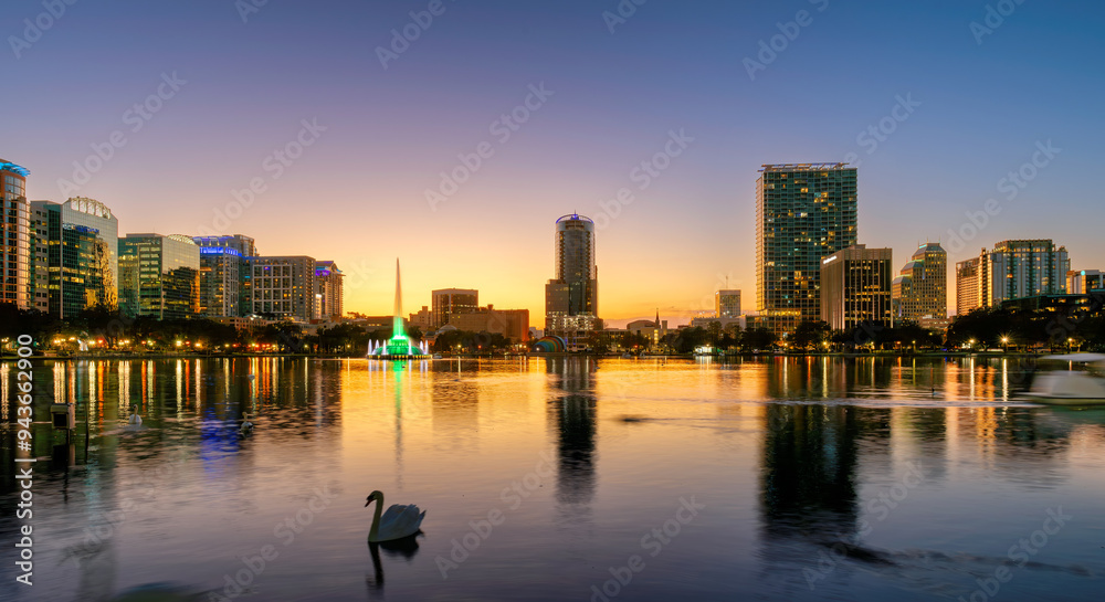 Orlando skyline lit at sunset. Panoramic view of Orlando city in Lake Eola, Florida, USA Orlando skyline lit at sunset. Panoramic view of Orlando city in Lake Eola, Florida, USA