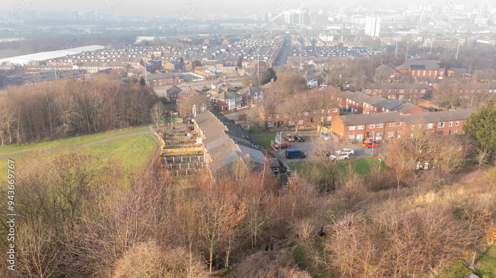 Aerial drone photo of an extremely foggy winters day taken over the city on Leeds West Yorkshire in the UK showing a typical British street in the winter time
