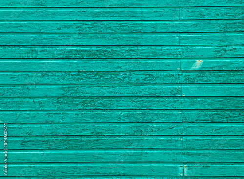 Obraz na plátně Full frame background texture of weathered horizontal wooden lap siding painted in a vibrant teal green color, showing minor paint chips and grain lines