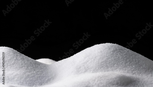 banner of sparkling fuffy white snow hills isolated on black photo