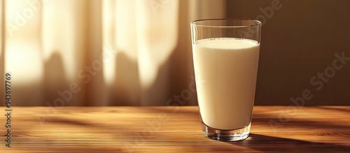 A glass of fresh milk on a ...