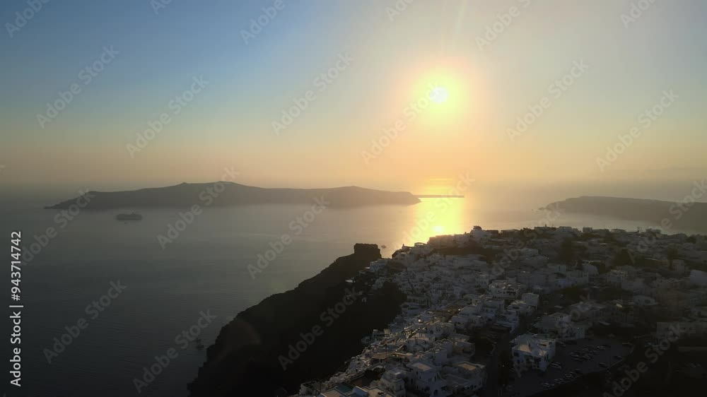 Aerial view at sunset of the volcano coasts of Santorini island in Greece Aerial view at sunset of the volcano coasts of Santorini island in Greece