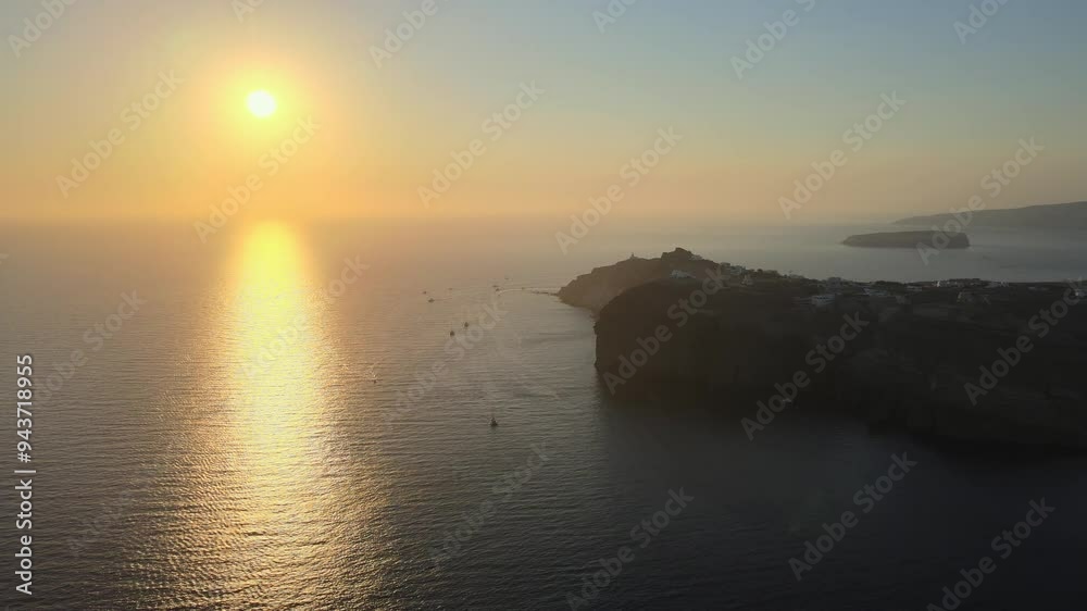 Aerial view at sunset of the volcano coasts of Santorini island in Greece Aerial view at sunset of the volcano coasts of Santorini island in Greece