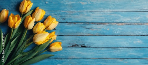 Yellow tulips on a rustic b...