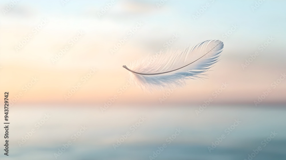 Ethereal feather floating gracefully in the air symbolizing lightness calmness and tranquility with ample copy space for text or design overlay Ethereal feather floating gracefully in the air symbolizing lightness calmness and tranquility with ample copy space for text or design overlay