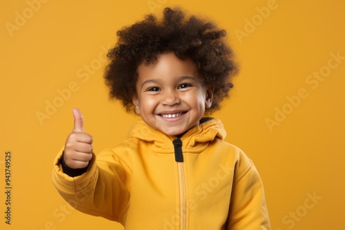 Smiling Child with Thumbs Up - Happy and Joyful Expression