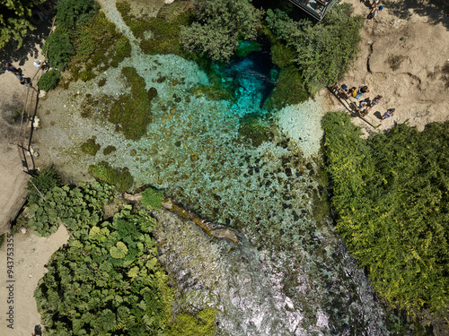 Aerial drone panorama landscape of Blue Eye (aka Syri i Kalter, springs of Bistrice) water spring. Located in Muzine in Finiq municipality, Albania photo