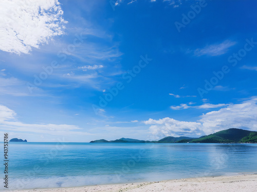 A sunlit cloudscape over sea and mountain