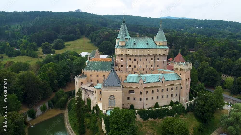 A stunning drone video of Bojnice Castle in Slovakia captures its fairy-tale architecture, picturesque towers, and lush gardens, highlighting the medieval charm and scenic views A stunning drone video of Bojnice Castle in Slovakia captures its fairy-tale architecture, picturesque towers, and lush gardens, highlighting the medieval charm and scenic views