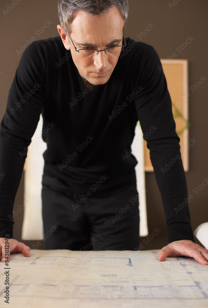Portrait of Man Looking at Blueprints Portrait of Man Looking at Blueprints