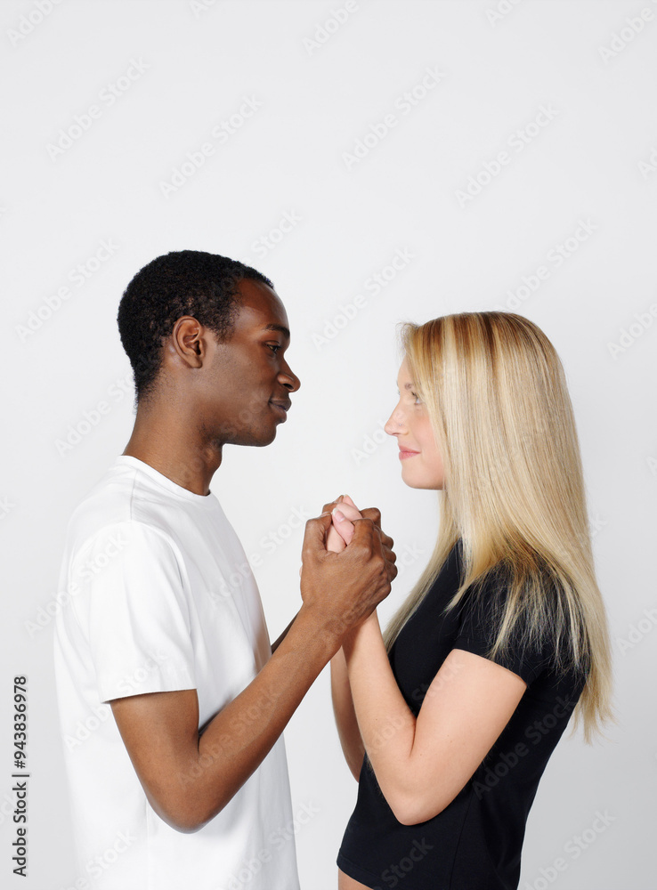 Couple Looking at Each Other and Holding Hands Couple Looking at Each Other and Holding Hands