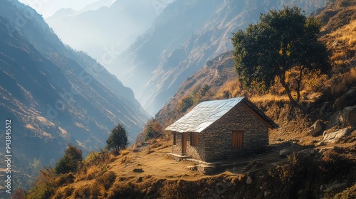 A small hut nestled in the mountains, surrounded by rugged terrain and natural beauty.