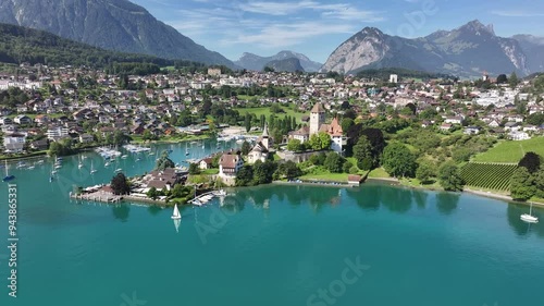 Aerial view of the town by Lake Thunersee in Spiez, Kanton Bern, Switzerland, showcasing the picturesque townscape and tranquil lakeside environment.