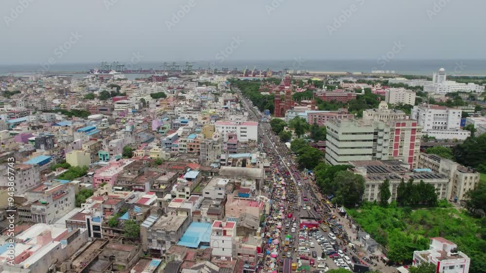 aerial view of residential area and market at sowcarpet near chennai high court with crowded buildings and Jawaharlal Nehru Stadium in the background. drone shot, daytime, 4k aerial view of residential area and market at sowcarpet near chennai high court with crowded buildings and Jawaharlal Nehru Stadium in the background. drone shot, daytime, 4k