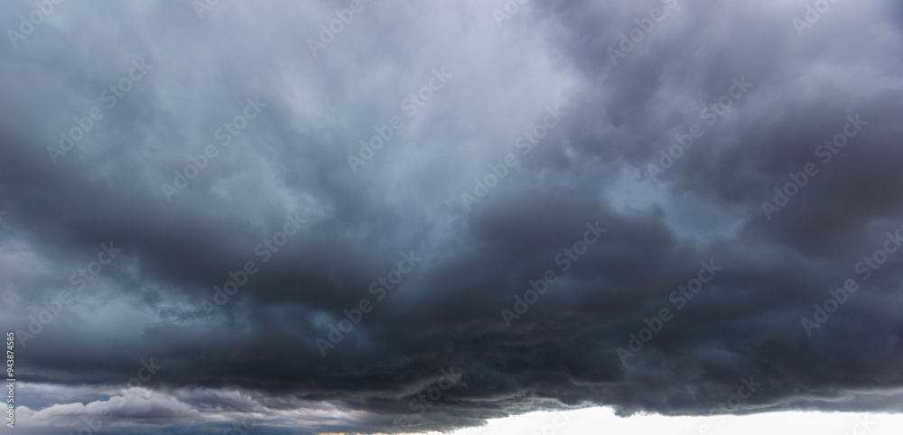 The dark sky with heavy clouds converging and a violent storm before the rain.Bad or moody weather sky and environment. carbon dioxide emissions, greenhouse effect, global warming, climate change The dark sky with heavy clouds converging and a violent storm before the rain.Bad or moody weather sky and environment. carbon dioxide emissions, greenhouse effect, global warming, climate change