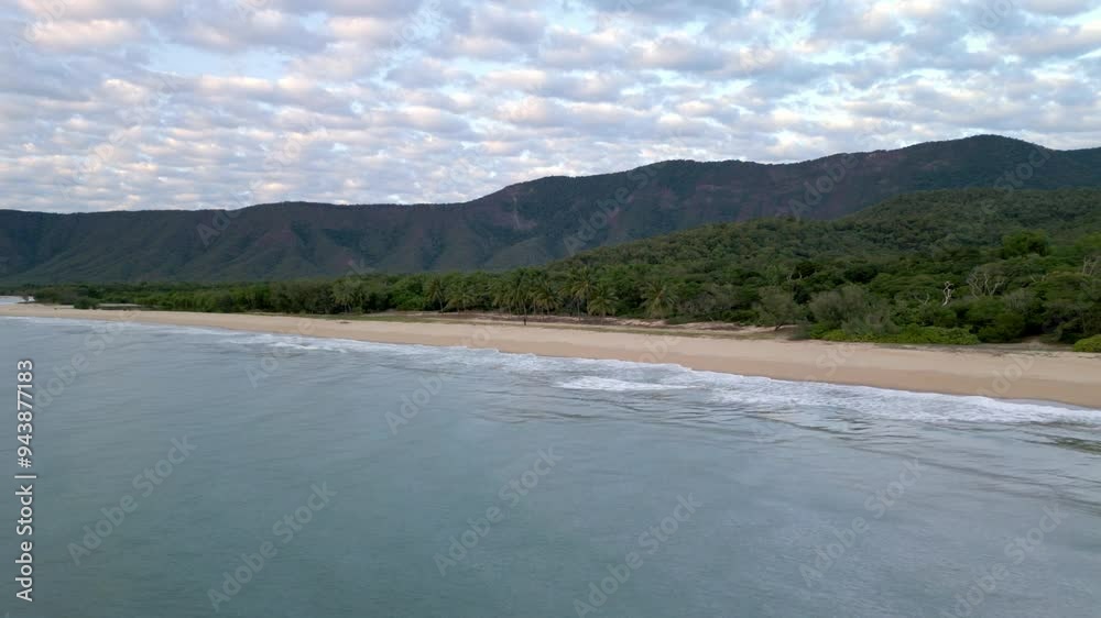 Aerial view of Wangetti Beach at dawn in 4K, highlighting the serene tropical coastline. Aerial view of Wangetti Beach at dawn in 4K, highlighting the serene tropical coastline.