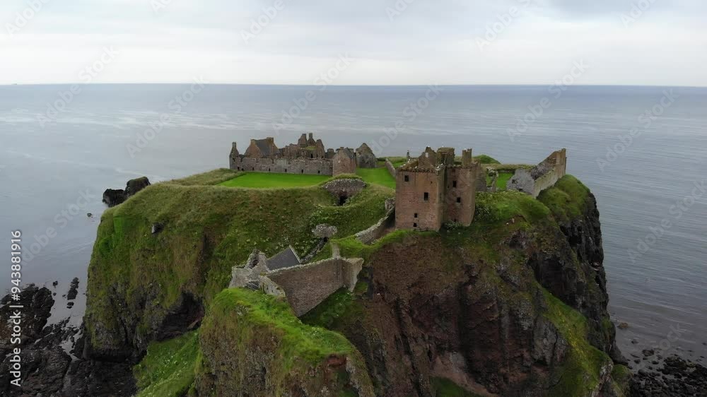 Ruins of a historic fortified castle complex with several stone buildings on an impressive steep bank. Ruins of a historic fortified castle complex with several stone buildings on an impressive steep bank.