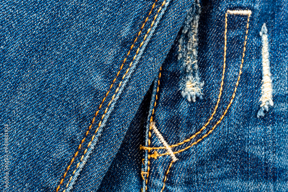 Jeans texture with seams close-up. Denim background. Seam Jeans texture with seams close-up. Denim background. Seam