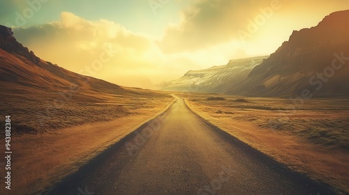 A road for safe travels with mountains, clouds, and trees in the background and a sun in the sky