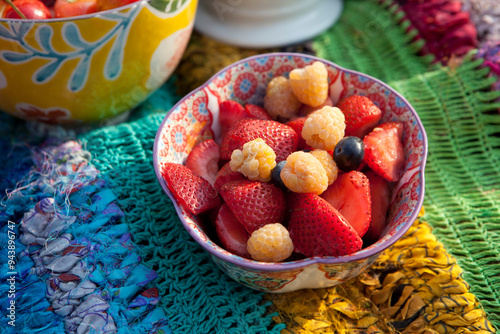 Bowl of Fruit on Picnic Blanket photo